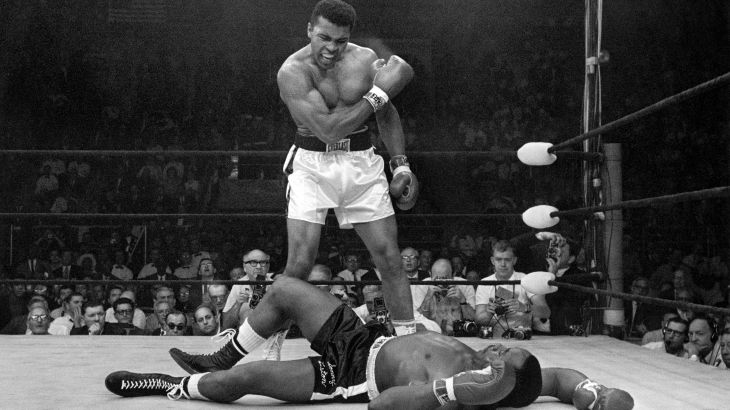 Heavyweight champion Muhammad Ali stands over fallen challenger Sonny Liston, shouting and gesturing shortly after dropping Liston with a short hard right to the jaw on May 25, 1965, in Lewiston, Maine. The bout lasted only one minute into the first round. Ali is the only man ever to win the world heavyweight boxing championship three times. He also won a gold medal in the light-heavyweight division at the 1960 Summer Olympic Games in Rome as a member of the U.S. Olympic boxing team. In 1964 he dropped the name Cassius Clay and adopted the Muslim name Muhammad Ali. (AP Photo/John Rooney)