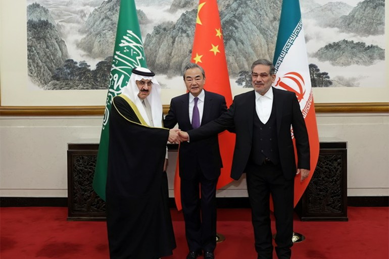 Iran, Saudi Arabia agree to resume diplomatic ties, reopen embassies BEIJING, CHINA - MARCH 10: (----EDITORIAL USE ONLY â MANDATORY CREDIT - "CHINESE FOREIGN MINISTRY / HANDOUT" - NO MARKETING NO ADVERTISING CAMPAIGNS - DISTRIBUTED AS A SERVICE TO CLIENTS----) Iran's top security official Ali Shamkhani (R), Chinese Foreign Minister Wang Yi (C) and Musaid Al Aiban, the Saudi Arabia's national security adviser pose for a photo after Iran and Saudi Arabia have agreed to resume bilateral diplomatic ties after several days of deliberations between top security officials of the two countries in Beijing, China on March 10, 2023. (Photo by CHINESE FOREIGN MINISTRY/Anadolu Agency via Getty Images)