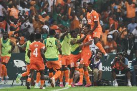 Ivory Coast's forward #22 Sebastien Haller (2R) celebrates with teammates after scoring his team's first goal during the Africa Cup of Nations (CAN) 2024 semi-final football match between Ivory Coast and Democratic Repuplic of Congo at Alassane Ouattara Olympic Stadium in Ebimpe, Abidjan on February 7, 2024. (Photo by FRANCK FIFE / AFP)