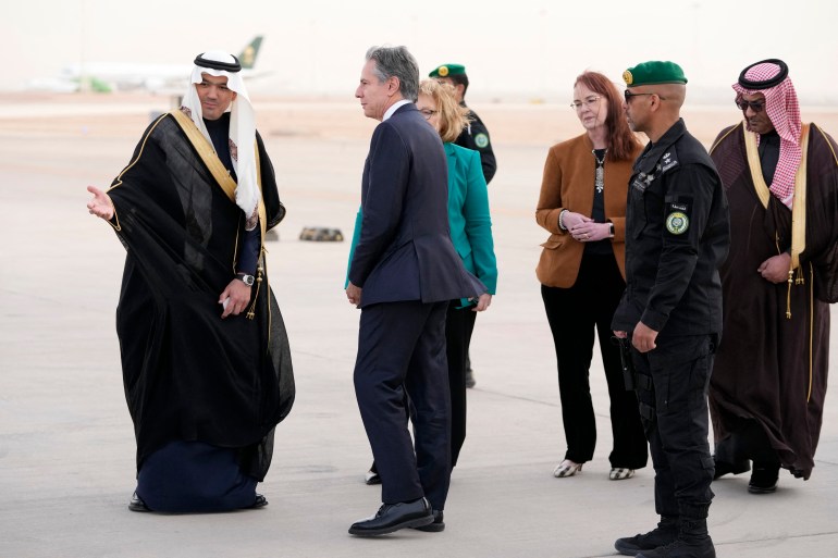 US Secretary of State Antony Blinken disembarks from the plane upon his arrival at King Khalid International Airport in the Saudi capital Riyadh on February 5, 2024. Partially seen third from left is Barbara Leaf, Assistant Secretary of State for Near Eastern Affairs, and Alison Dilworth, Deputy Chief of Mission, third from right. - Blinken arrived in Saudi Arabia on February 5 for another Middle East crisis tour, hoping to secure a new truce in the Israel-Hamas war as Gaza saw no let-up in fighting. (Photo by Mark Schiefelbein / POOL / AFP)