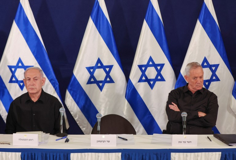 Israeli prime minister Benjamin Netanyahu and Cabinet minister Benny Gantz during a press conference in the Kirya military base in Tel Aviv , Israel , 28 October 2023. ABIR SULTAN POOL/Pool via REUTERS