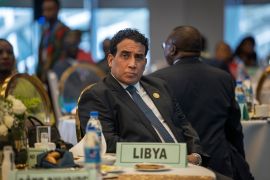 Mohammed al-Menfi, Chairman of the Presidential Council of Libya, looks on during an event before the opening ceremony of the 37th Ordinary Session of the Assembly of the African Union (AU) at the AU headquarters in Addis Ababa on February 17, 2024. (Photo by Michele Spatari / AFP)