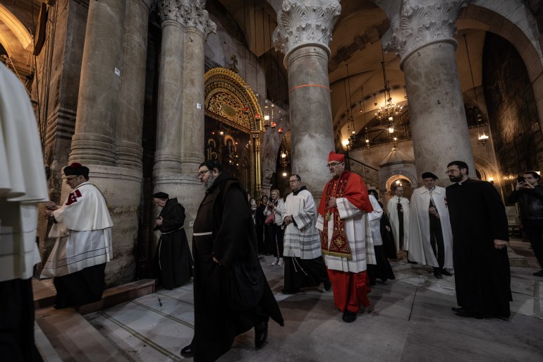 JERUSALEM - MARCH 24: Religion men attend the Palm Sunday celebrations at Church of the Holy Sepulchre in Jerusalem on March 24, 2024. During the Palm Sunday believers commemorate the triumphal entry of Jesus into Jerusalem and mark the beginning of the rites of the Holy Week which concludes on Easter Sunday. (Photo by Mostafa Alkharouf/Anadolu via Getty Images)