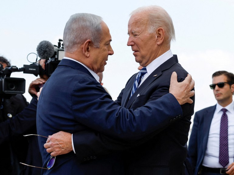 FILE PHOTO: U.S. President Joe Biden is welcomed by Israeli Prime Minster Benjamin Netanyahu, as he visits Israel amid the ongoing conflict between Israel and Hamas, in Tel Aviv, Israel, October 18, 2023. REUTERS/Evelyn Hockstein/File Photo