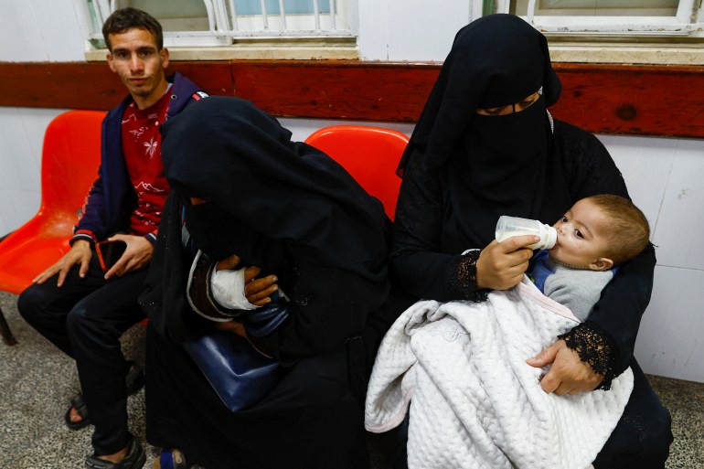 A Palestinian boy is bottle-fed at Abu Yousef al-Najjar hospital, while Gaza residents face crisis levels of hunger and soaring malnutrition, in Rafah in the southern Gaza Strip January 24, 2024. REUTERS/Ibraheem Abu Mustafa