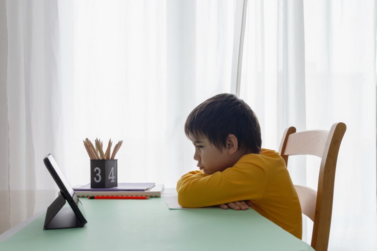 child do homework on their own, preschooler boy steress, naughty kid, children education in front of tablet pc; Shutterstock ID 1748888540; purchase_order: aljazeera ; job: ; client: ; other: