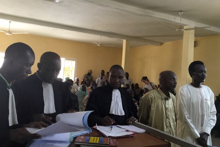 Members of the Military Command Council for the Salvation of the Republic Ahmat Yacoub Adam (R) and Hassan Boulmaye (2nd R) stand in N'djamena court for the verdict in their trial on June 6, 2019. Two leaders of a major Chadian rebel group were sentenced on June 6, 2019 in N'Djamena to life imprisonment for participating in 
