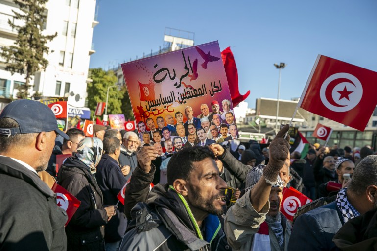 TUNIS, TUNISIA - JANUARY 14: People gather to stage a protest demanding the release of prisoners and improvement of the their socio-economic status on the 13th anniversary of the Tunisian Revolution in Tunis, Tunisia on January 14, 2024. (Photo by Yassine Gaidi/Anadolu via Getty Images)