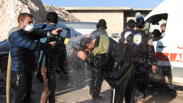 reduce the effectIDLIB, SYRIA - APRIL 4: Civil defense members try to reduce the effects of chlorine gas with water as they carry out search and rescue works after a suspected chlorine gas attack by Assad Regime forces to Khan Shaykhun town of Idlib, Syria on April 4, 2017.