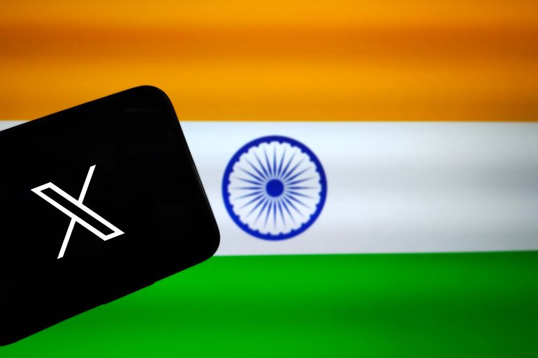 Tamilnadu, India - October 09 2023 : Logo of X (formerly Twitter), now owned by Elon Musk displayed on a smartphone with blurred Indian flag background