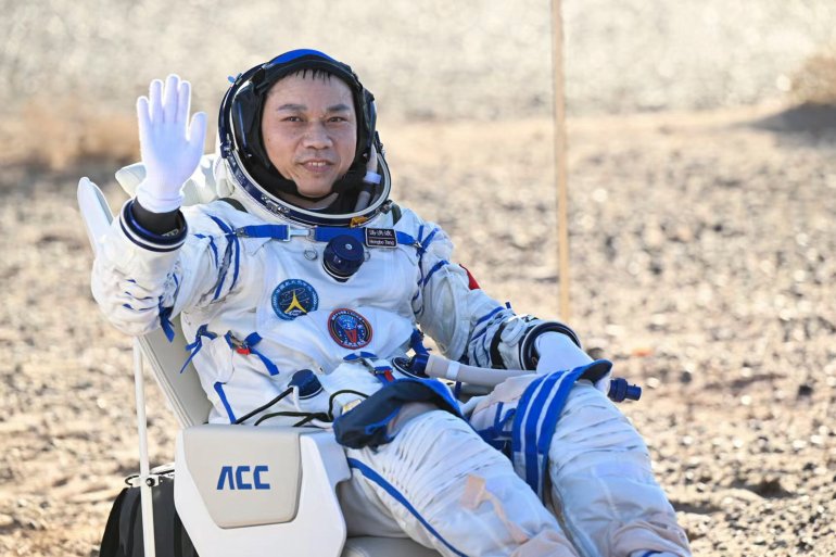 In this photo released by Xinhua News Agency, Tang Hongbo, a Chinese astronaut and a commander sits near the capsule of the Shenzhou-17 manned space mission waves after landing at the Dongfeng landing site in north China's Inner Mongolia Autonomous Region, Tuesday, April 30, 2024. China's Shenzhou-17 spacecraft returned to Earth Tuesday, carrying three astronauts who have completed a six-month mission aboard the country's orbiting space station. Credit: Bei He/Xinhua via AP