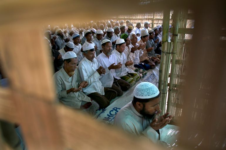 SITTWE, MYANMAR - NOVEMBER 23: Rohingya pray inside a makeshift mosque during Friday prayer IDP camp November 23, 2012 on the outskirts of Sittwe, Myanmar. An estimated 111,000 people were displaced by sectarian violence in June and October affecting mostly the ethnic Rohingya people who are now living in crowded IDP camps racially segregated from the Rakhine Buddhists in order to maintain stability. Around 89 lives were lost during a week of violence in October, the worst in decades. As of 2012, 800,000 Rohingya live in Myanmar. According to the UN, they are one of the most persecuted minorities in the world. (Photo by Paula Bronstein/Getty Images)