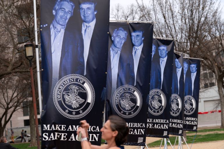 Banners with a photograph of President Donald Trump and Jeffrey Epstein are seen on the National Mall, Wednesday, March 11, 2026 in Washington. (AP Photo/Jose Luis Magana)