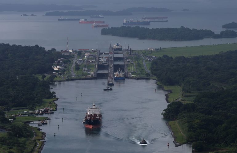 COLON, PANAMA - SEPTEMBER 20: In an aerial view, ships pass through the Aqua Clara locks as they transit through the Panama Canal on September 20, 2023 in Colon, Panama. The Panama Canal Authority is continuing to restrict the number of vessels that pass through the Panama Canal locks as drought has caused water levels at Gatun Lake to drop. The locks depend on millions of gallons of fresh water from the manmade lake to fill locks in Panama City and Colon in order to transit shipping vessels from the Pacific Ocean to the Caribbean Sea. Over one hundred ships are waiting to transit the canal and the backup could delay goods heading to the United States for the holiday season. It takes an average of 8-10 hours for a ship to transit the 50 miles through the canal versus several weeks to travel thousands of miles around Cape Horn and the southernmost parts of South America. (Photo by Justin Sullivan/Getty Images)