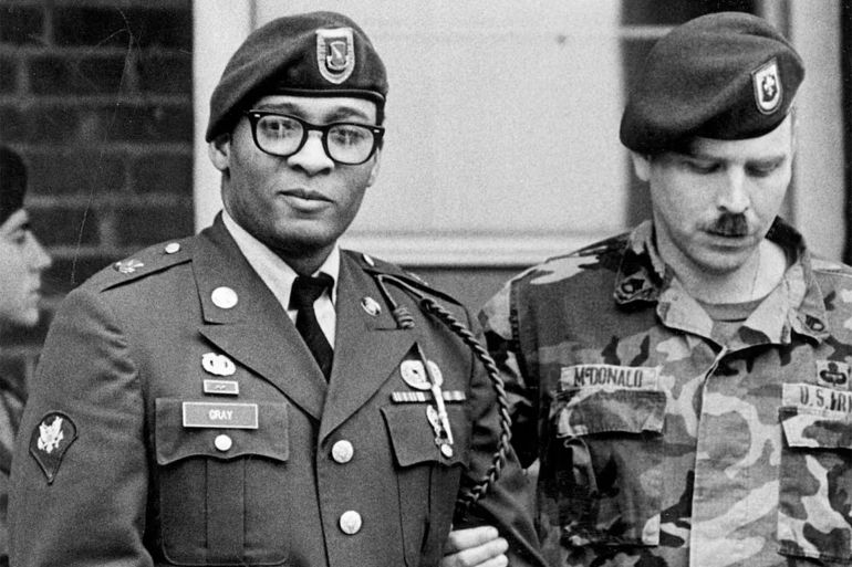 Ronald Gray leaves a courtroom escorted by military police at Fort Bragg, North Carolina, on April 6, 1988.Marcus Castro / AP file