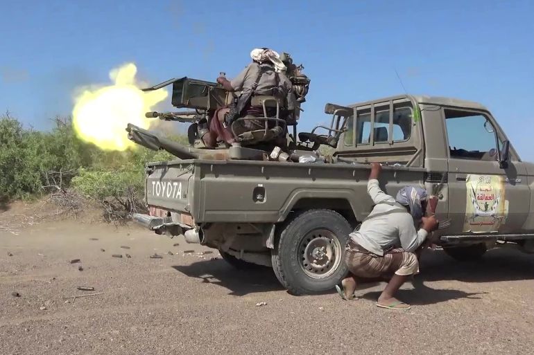 TOPSHOT - This screen grab taken from video footage released by the pro-Yemeni government Southern Giants Brigades on October 6, 2026 shows a fighter firing a turrent from the back of a "technical" pickup truck during clashes with Houthis in Taiz province.