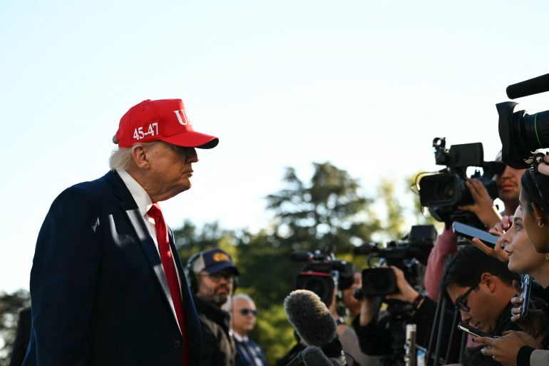 US President Donald Trump speaks to the press upon his return to the White House in Washington, DC, on October 6, 2026.