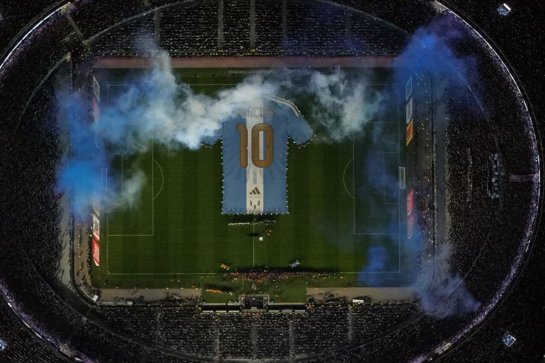 A giant t-shirt with Lionel Messi's number 10 is displayed before an international friendly soccer match against Benin, marking his farewell appearance for the national team, in Buenos Aires, Argentina, Tuesday, Oct.6, 2026. (AP Photo/Rodrigo Abd)