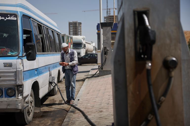 A man refuels a van at a gas station in Damascus, Syria, Thursday, Sept. 17, 2026. (AP Photo/Ghaith Alsayed)