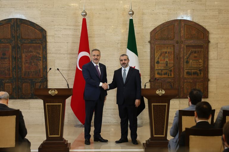 epa13237030 Syrian Foreign Minister Asaad al-Shaibani (R) and Turkish Foreign Minister Hakan Fidan (L) shake hands during a joint press conference at the Tishreen Palace in Damascus, Syria, 13 September 2026. The ministers discussed energy cooperation, border security, and an upcoming visit by Turkish President Erdogan. EPA/MOHAMED AL RIFAI