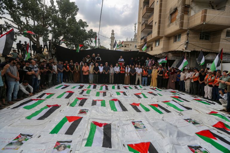 NUSEIRAT, GAZA - SEPTEMBER 29: (EDITOR'S NOTE: Image depicts death.) A mass funeral is held for 50 Palestinians killed in the Israel-Hamas war on September 29, 2026 in Nuseirat, Gaza. The funeral is being held to bury the recently-recovered remains of around 50 Palestinians killed in the Nuseirat camp in central Gaza during Israeli strikes earlier in the war. (Photo by Ahmad Hasaballah/Getty Images)