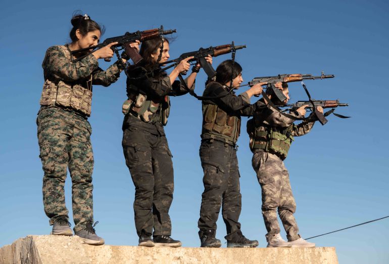 HASAKEH, SYRIA - SEPTEMBER 8: YPJ fighters pose with weapons atop a military obstacle course in the premises of a base on September 8, 2026 in Hasakeh, Syria. Female Kurdish fighters in Syria have been negotiating with the country's new government to retain a combat role, following a security overhaul in which Kurdish-forces are to be integrated into regular Syrian forces. The Women's Protection Units, or YPJ according to their Kurdish initials, have been allies of the U.S.-backed Syrian Democratic Forces (SDF) during the country's long civil war and in the fight with the Islamic State group in Syria's northeast. (Photo by Anagha Subhash Nair/Getty Images)