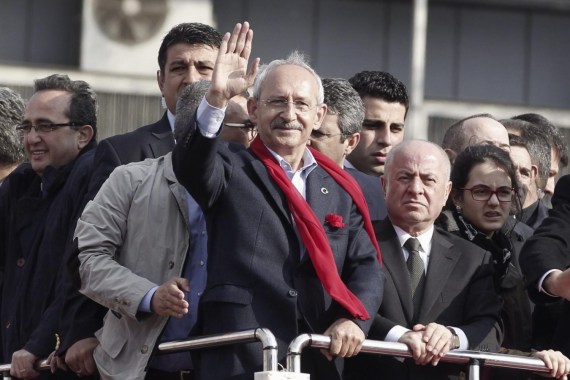 Kemal Kilicdaroglu, leader of the main opposition Republican People's Party (CHP), greets his supporters during an election rally in Istanbul March 29, 2014. Turkey has started an espionage investigation after a discussion between top officials on potential military action in Syria was leaked on YouTube, heralding a possible government crackdown on its political opponents after elections on Sunday. The recording of the meeting between Turkey's intelligence chief, foreign minister and deputy head of the military was by far the most serious breach in weeks of highly sensitive leaks, a scandal which Prime Minister Erdogan has cast as a plot to sabotage the state and topple him. REUTERS/Osman Orsal (TURKEY - Tags: POLITICS ELECTIONS)