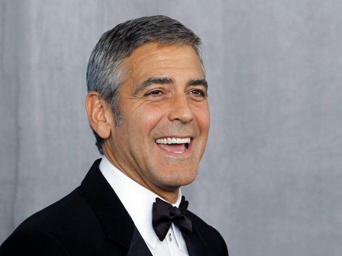 Actor George Clooney poses backstage after receiving the Bob Hope Humanitarian Award at the 62nd annual Primetime Emmy Awards in Los Angeles, California, August 29, 2010.
