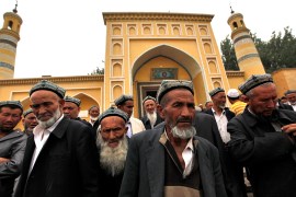 epa04336797 (FILES) File picture dated 24 May 2013 of Muslim men of the Uighur ethnic group leaving the Id Kah Mosque after Friday prayers in Kashgar, Xinjiang Uighur Autonomous Region, China. The imam of one of China's most important mosques has been killed because of his opposition to recent violence by members of his ethnic Uighur community in the far western region of Xinjiang, US-based Radio Free Asia reported 31 July 2014. Jume Tahir, imam of the ancient Id Kah mosque in Kashgar, was found in a pool of blood outside the compound early Wednesday. EPA/HOW HWEE YOUNG