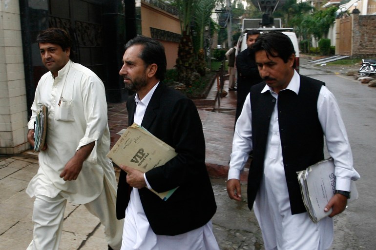Samiullah Afridi, a Pakistani doctor who helped U.S. officials find Osama bin laden, arrives in court in Peshawar