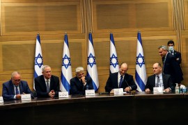 Israeli Prime Minister Naftali Bennett and some of his government attend its first cabinet meeting in the Knesset, Israel's parliament, in Jerusalem