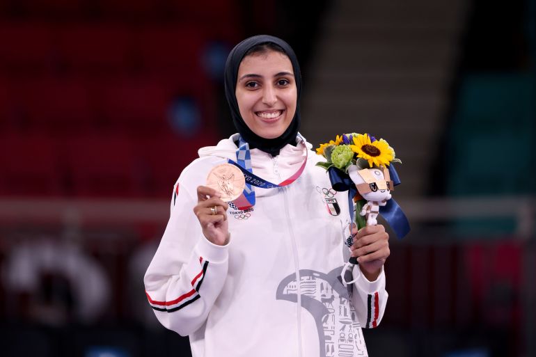 Karate - Olympics: Day 14 TOKYO, JAPAN - AUGUST 06: Bronze medalist Giana Lotfy of Team Egypt poses with the bronze medal for the Women’s Karate Kumite -61kg on day fourteen of the Tokyo 2020 Olympic Games at Nippon Budokan on August 06, 2021 in Tokyo, Japan. (Photo by Harry How/Getty Images)