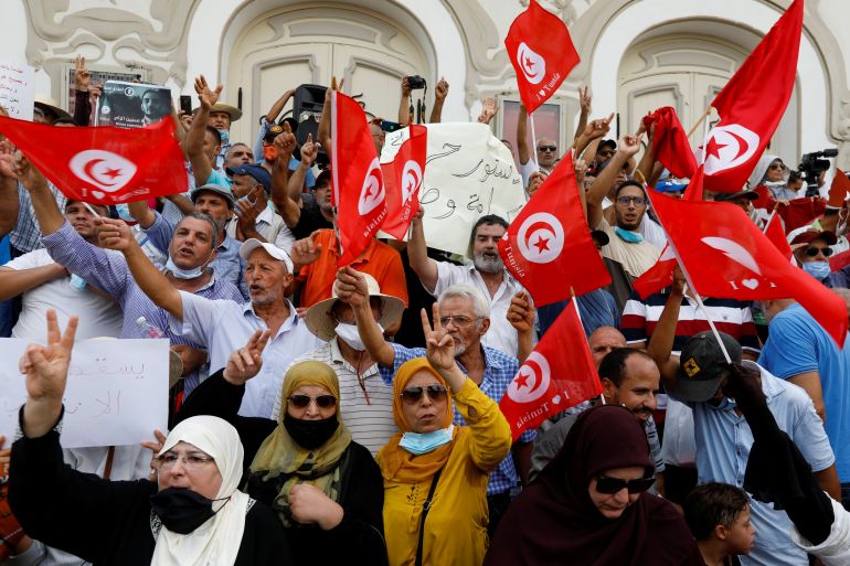 Opponents of Tunisia's President Kais Saied protest against what they call his coup on July 25, in Tunis