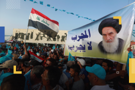 Supporters of the Al Sairun Party, which is backed by the Iraqi Shi'ite cleric Moqtada al-Sadr, hold a poster of Iraq's top Shi'ite cleric, Grand Ayatollah Ali al-Sistani, while attending a campaign rally, ahead of the parliamentary election in Baghdad, Iraq May 4, 2018. REUTERS/Alaa al-Marjani